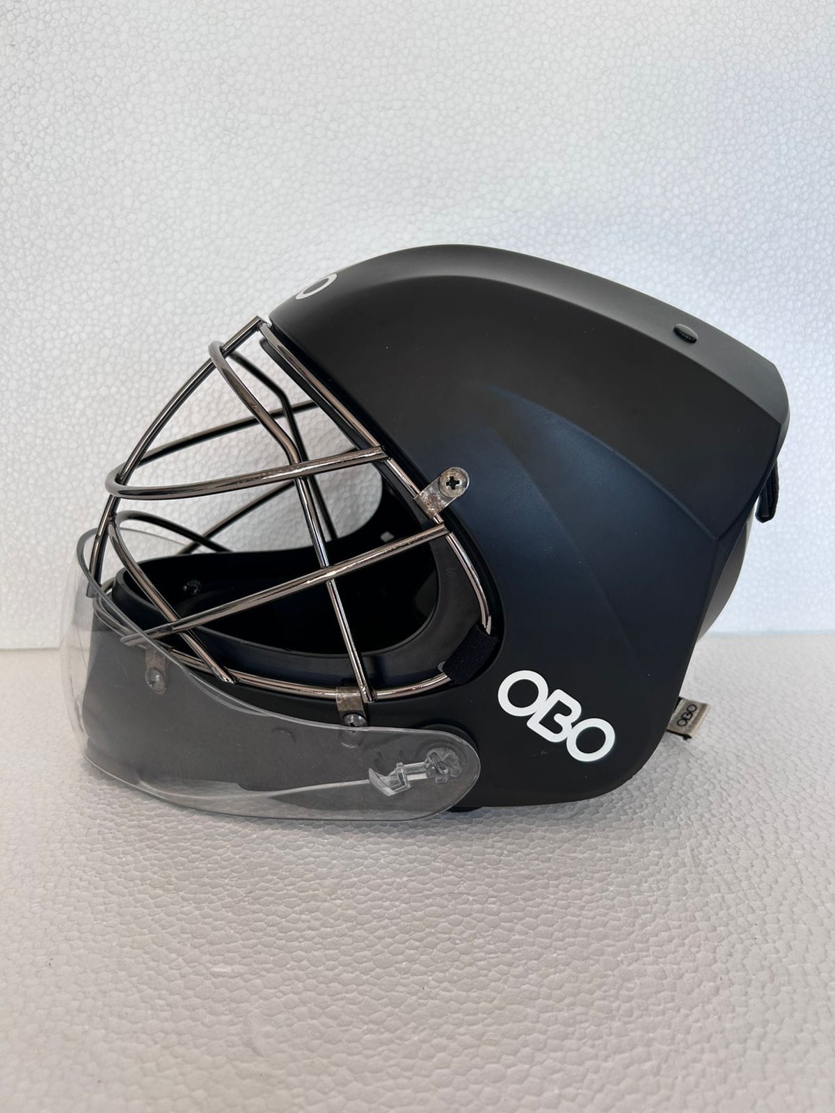 OBO ABS Large black field hockey goalkeeper helmet with silver face cage and clear throat protector